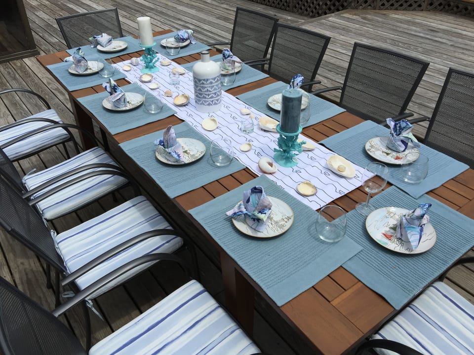 Outdoor dinning with teak extendable dinning table sits up to 12