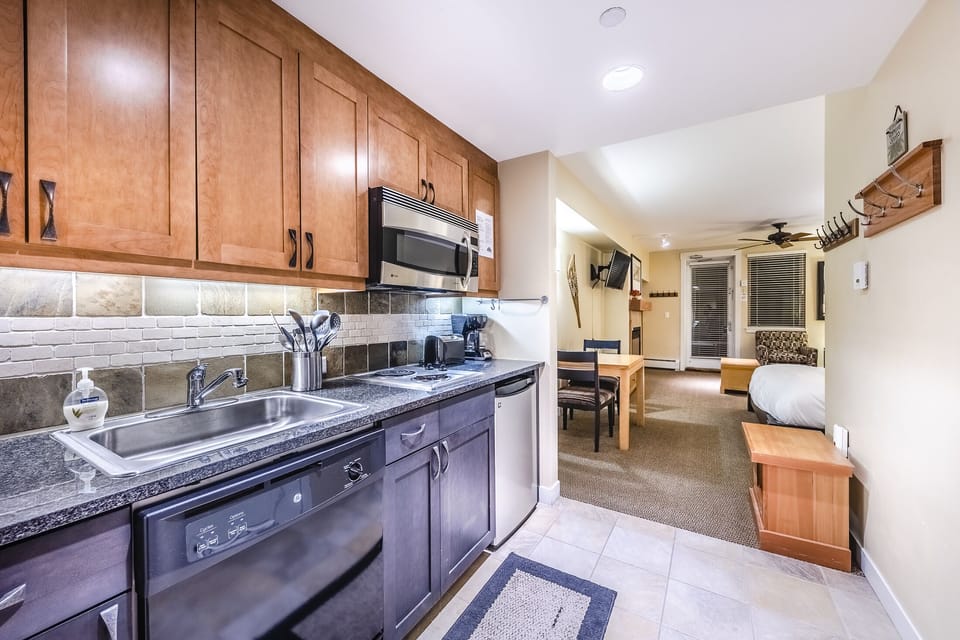 Kitchen - Also offers coffee maker, toaster, and cooking utensils.