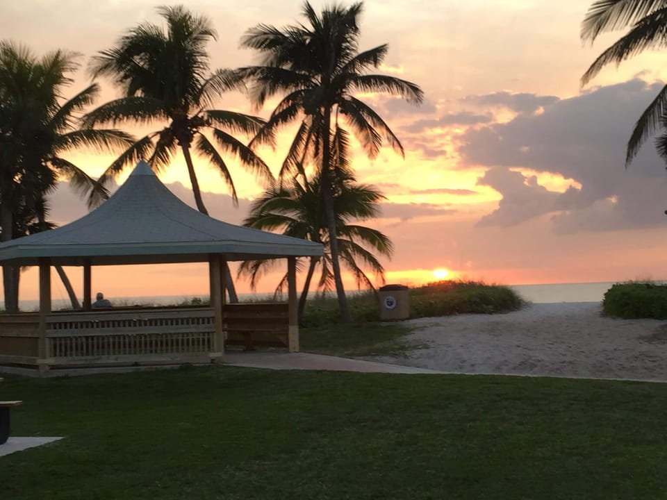 Beautiful sunsets just steps away!  Less than one block from our condo.