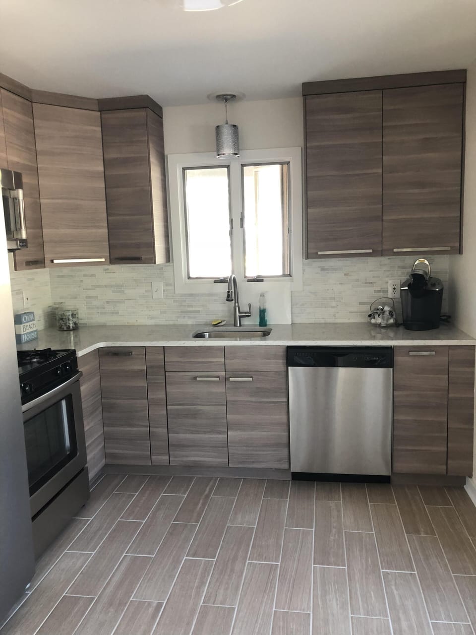 Dishwasher refrigerator stove and microwave on first floor kitchenette 