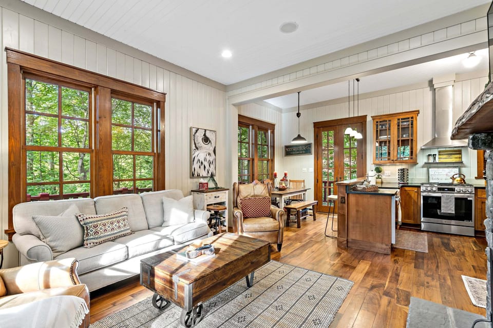 Main-level living room with a wood-burning fireplace and flat-screen TV with streaming options.