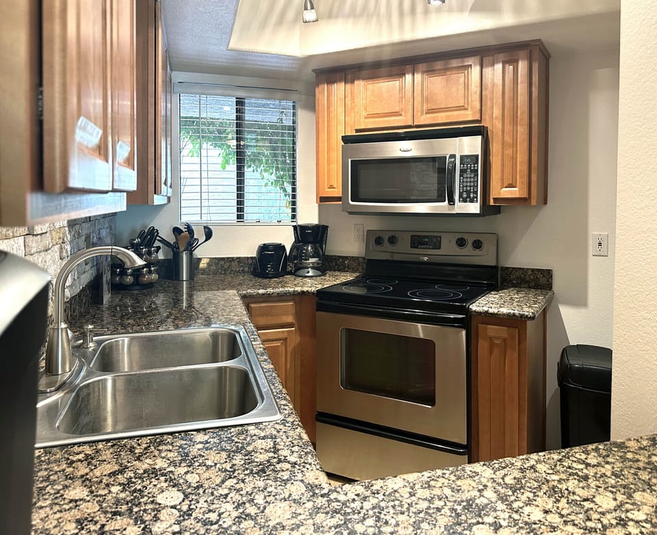 Kitchen has 4 coffee makers, knife sets, bakeware, BBQ utensils, and more