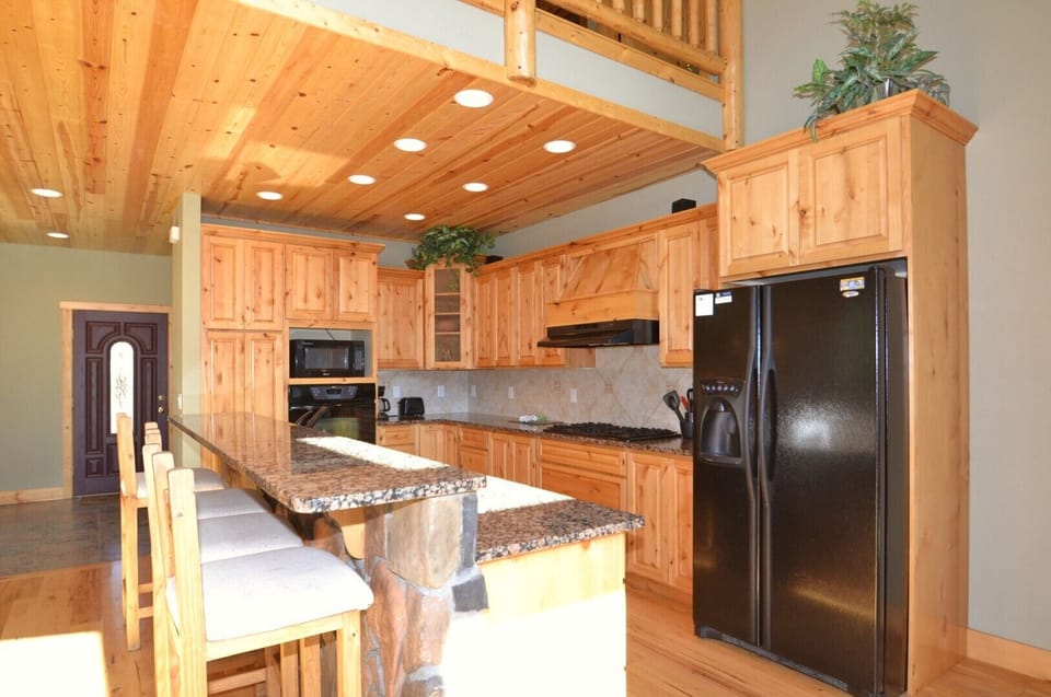 Comfortable kitchen with granite counter tops.