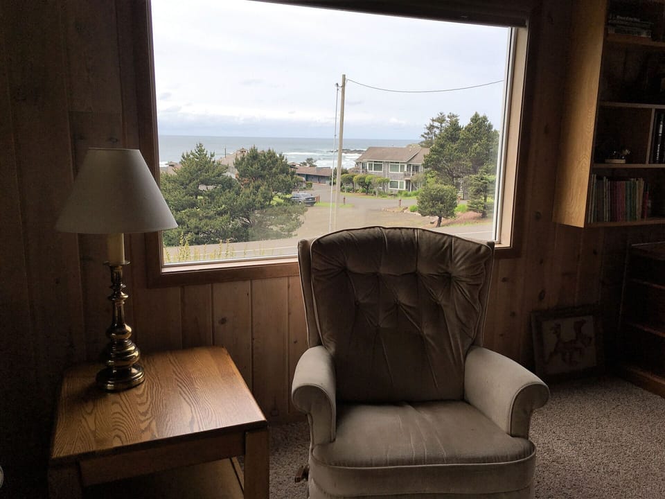 Easy chair in family room- Oceanview behind.