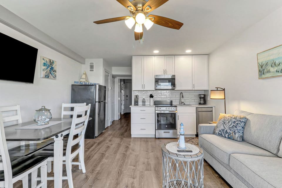 Seaside Villas 353 - An overview of the main living area in this unit. Features a kitchenette and fridge, great for storing any groceries!