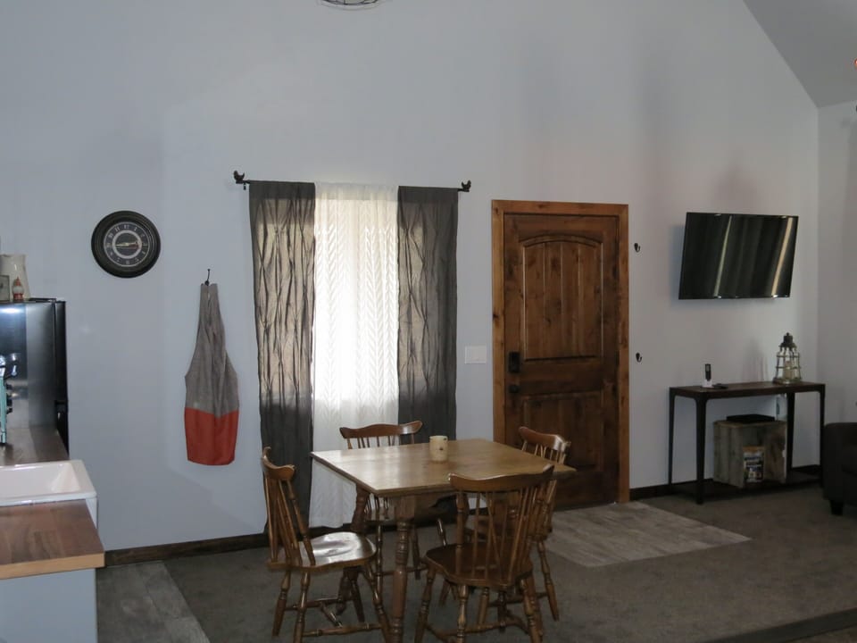 Seating for four with bedside stools available for additional kitchen seating