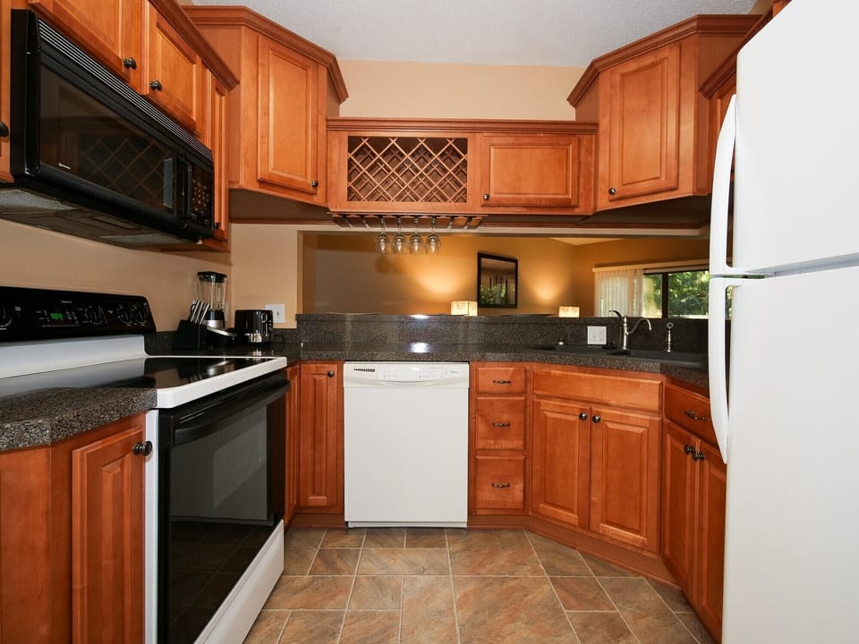 Ocean Breeze 100 - Kitchen - Beautiful and fully stocked kitchen with newer cabinetry and granite counter tops.