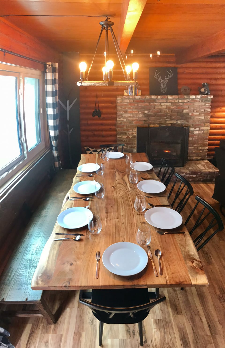 A large dining nook in front of the fire easily fits 8 for family meals