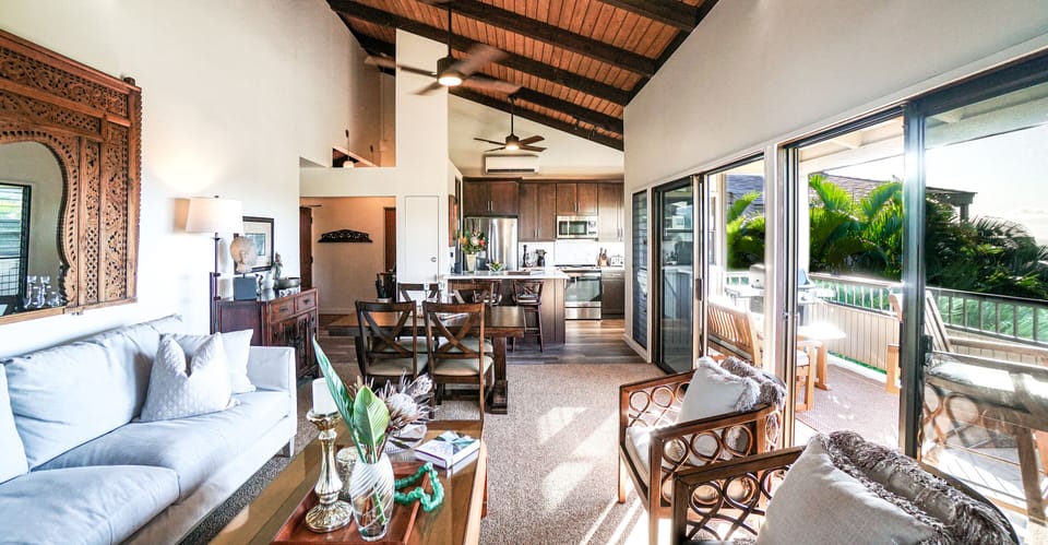 The renovated kitchen flows into the dining and living space.