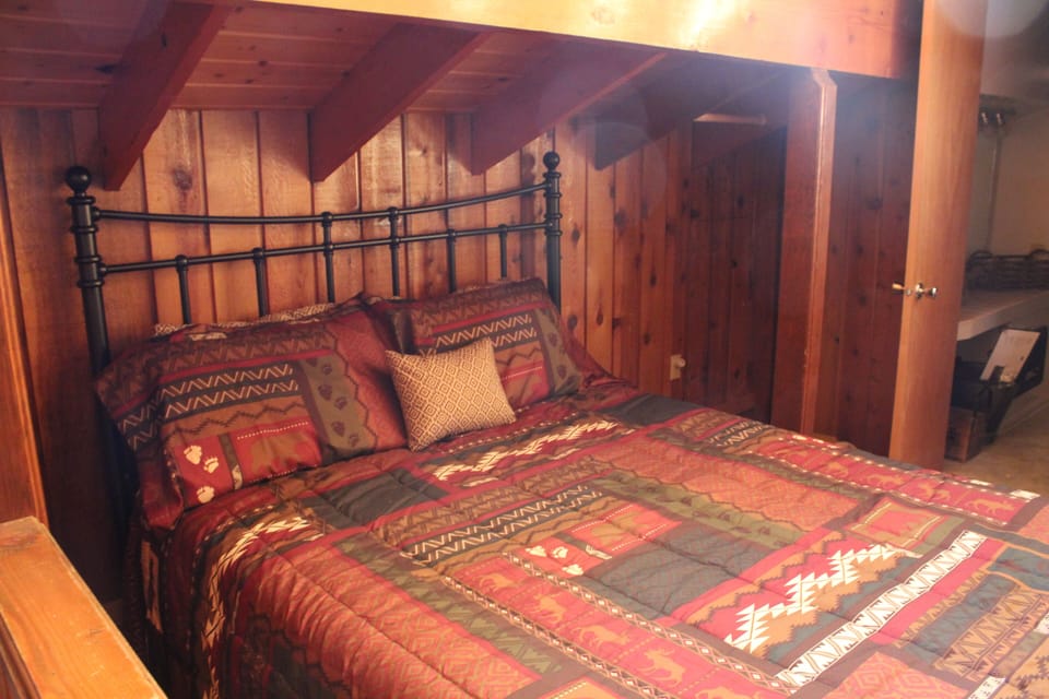 Upstairs loft bed with private bathroom