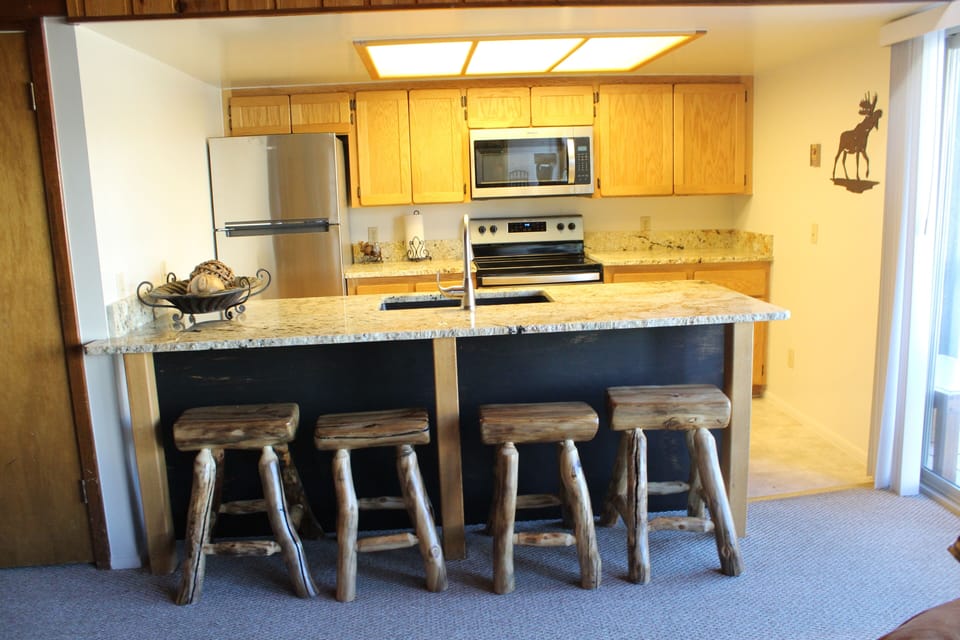 New granite kitchen with stainless steel appliances ready for use