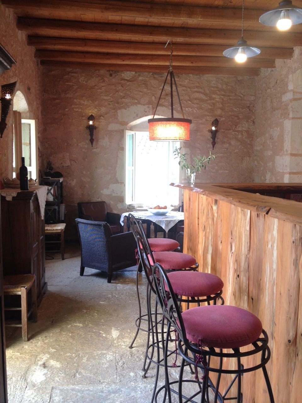 View on the living room with bar and kitchen on the right side
