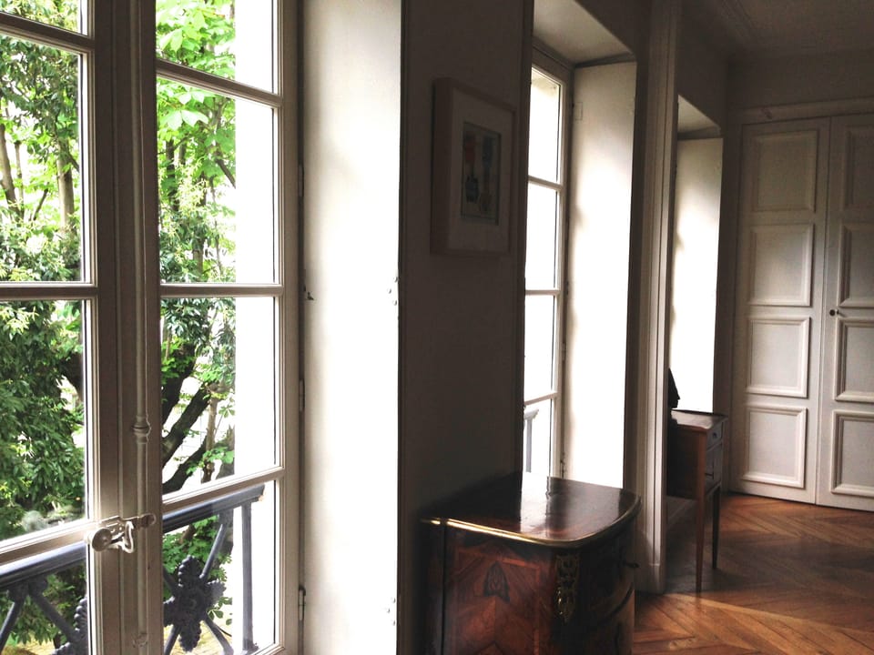 Master bedroom windows overlooking garden.