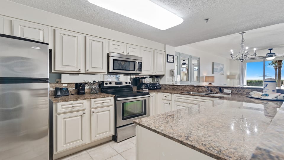 The kitchen is fully loaded with all cookware and utensils