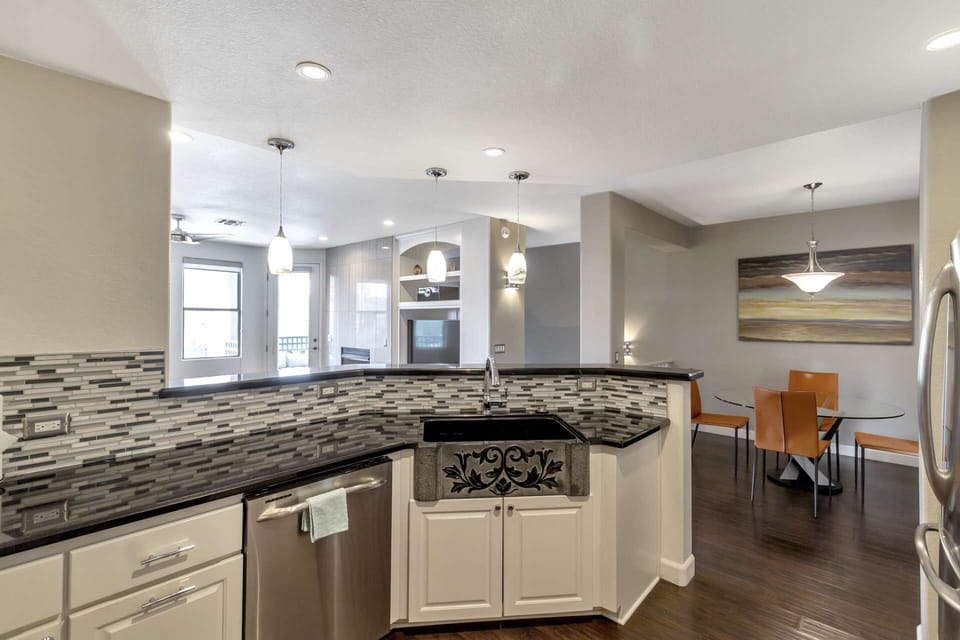 Kitchen with glass top stove, microwave, dishwasher, coffee maker & more