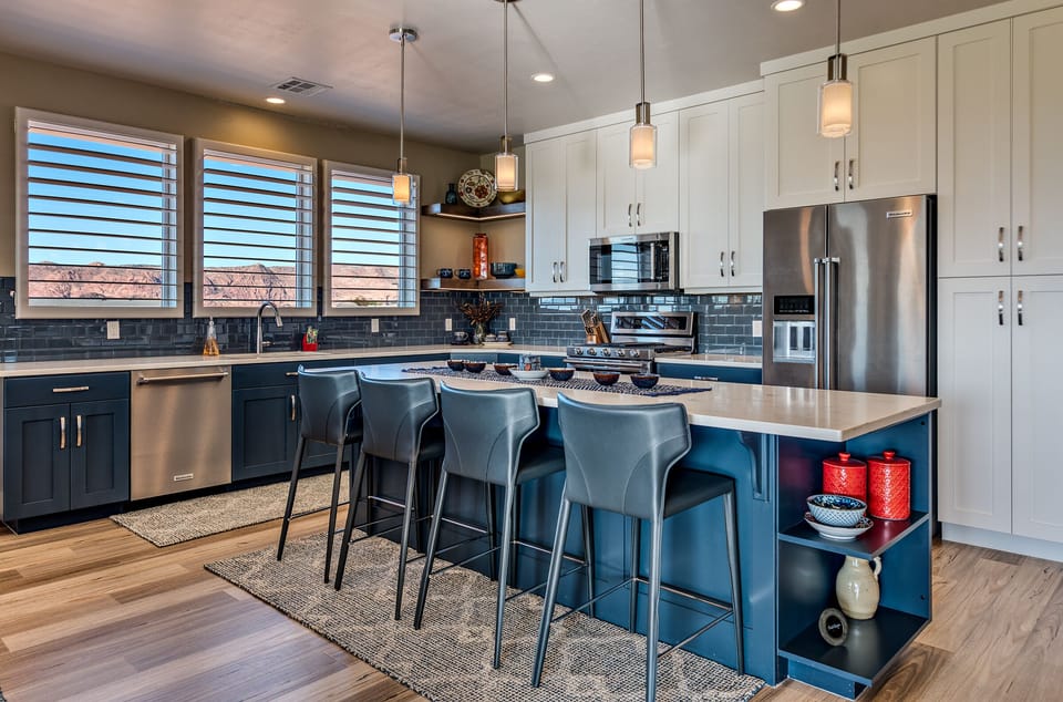 Kitchen Island & Barstools - The Kitchen Island comfortably seats 4 adults and creates a great space for serving and preparing meals.