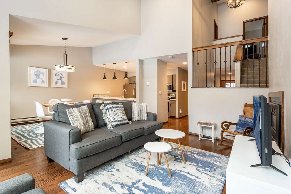 Views of the living, dining, kitchen and stairway to the upstairs bedrooms.