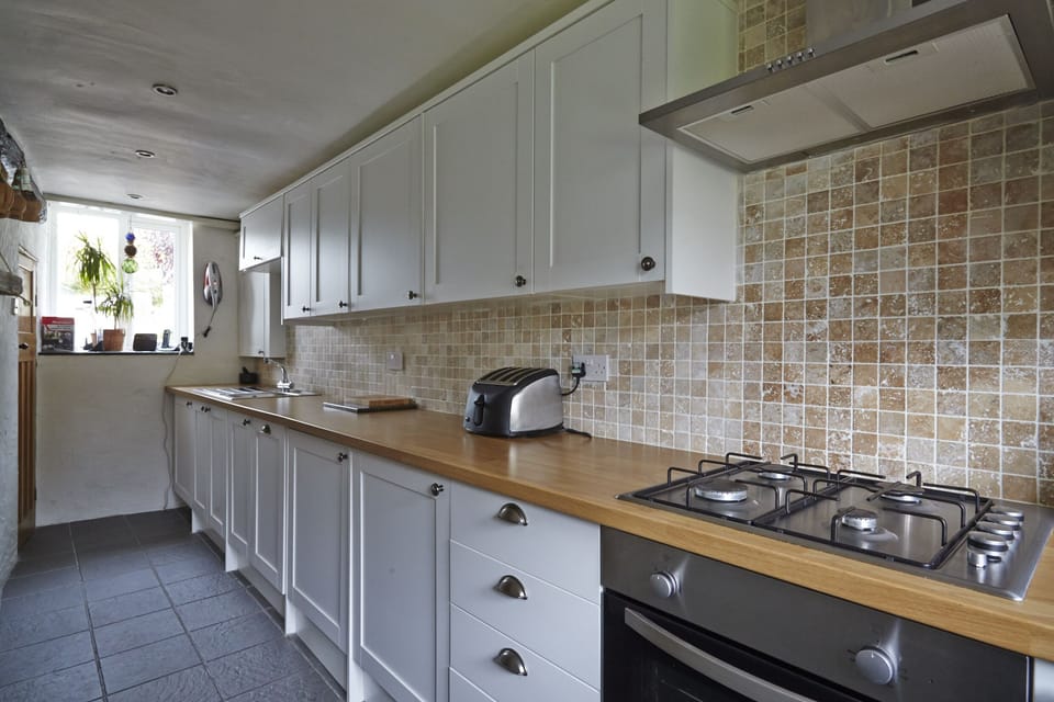 Galley Kitchen Washing machine is at the end.