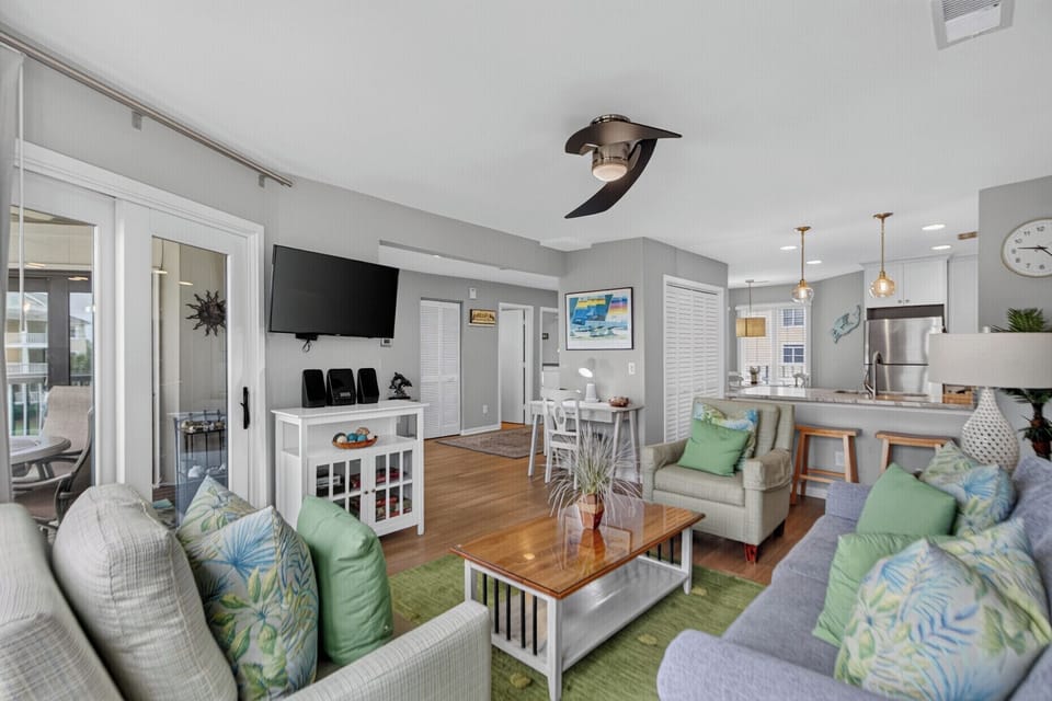 Step into your coastal retreat where soft, breezy hues and sunny hardwood floors welcome you home. Lounge on plush sofas, gather at the dining table, or whip up your favorite meals in your fully-equipped kitchen.