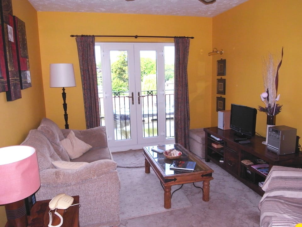Lounge has French windows & Juliet Balcony over looking river and Locks below