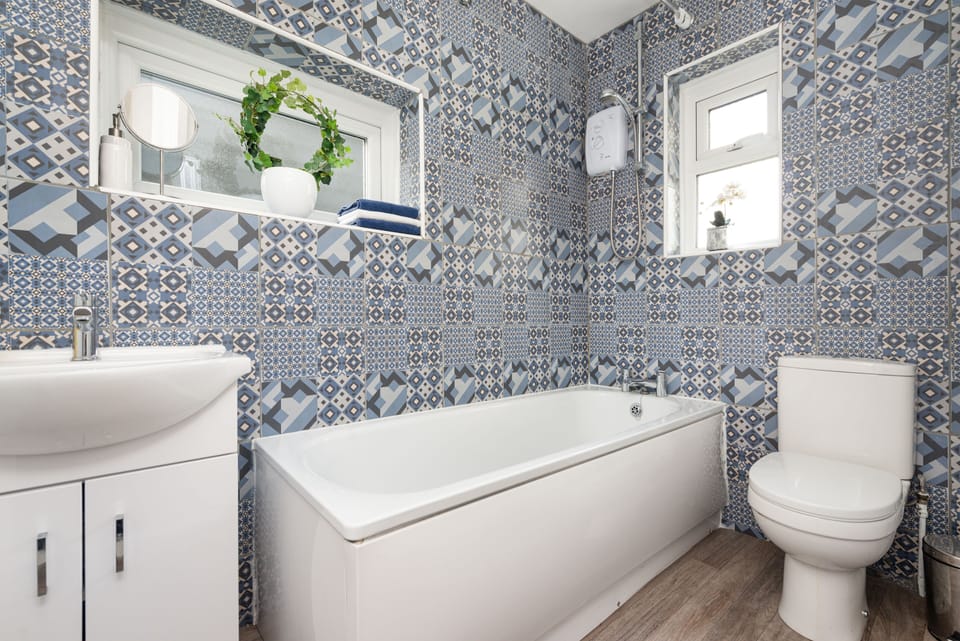 Bathroom with electric shower.