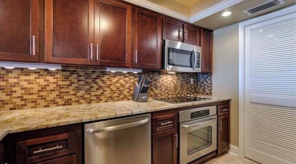 Built in cooktop stove and oven with large overhead microwave 