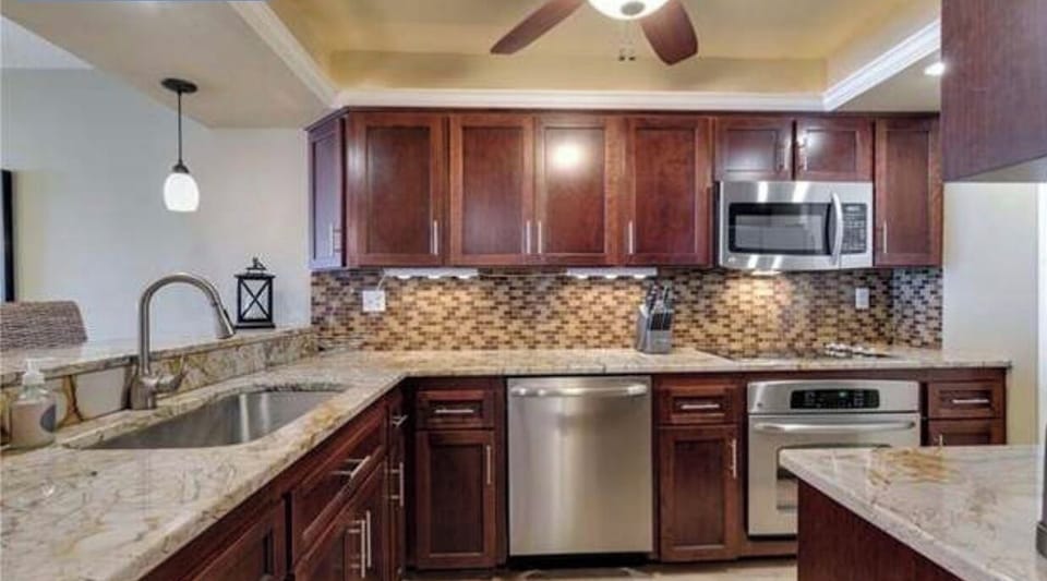 Kitchen with large under-mount sink, dishwasher and backsplash