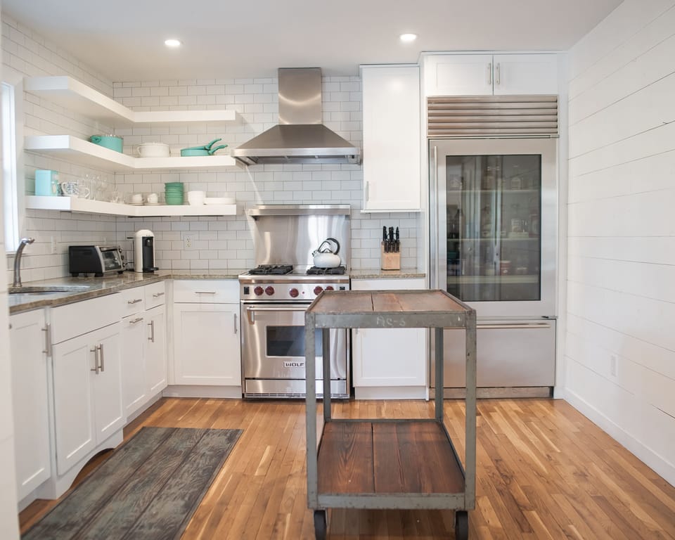 Kitchen with Sub-Zero fridge, Wolf oven and Miele dishwasher. 