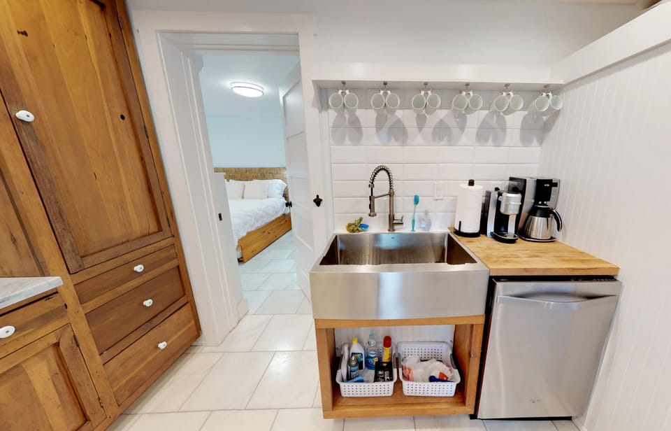 Large Stainless Farm Sink with Coffee Center and Subway TIle Wall