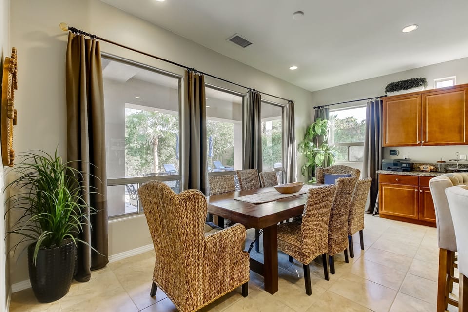 Table for 8 with two oversized chairs at the ends 