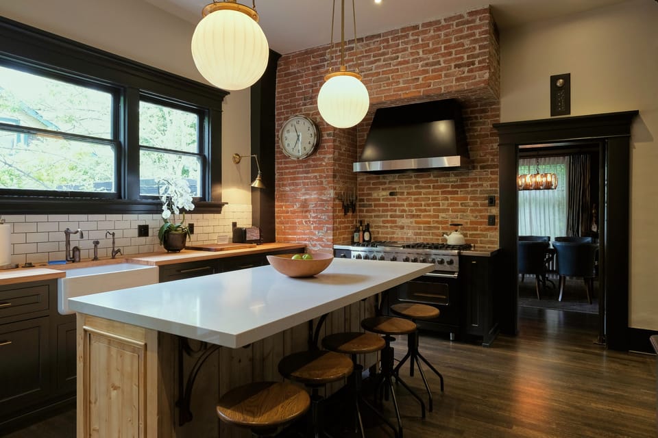The chef's kitchen with double oven, 6 burners, and large fridge.