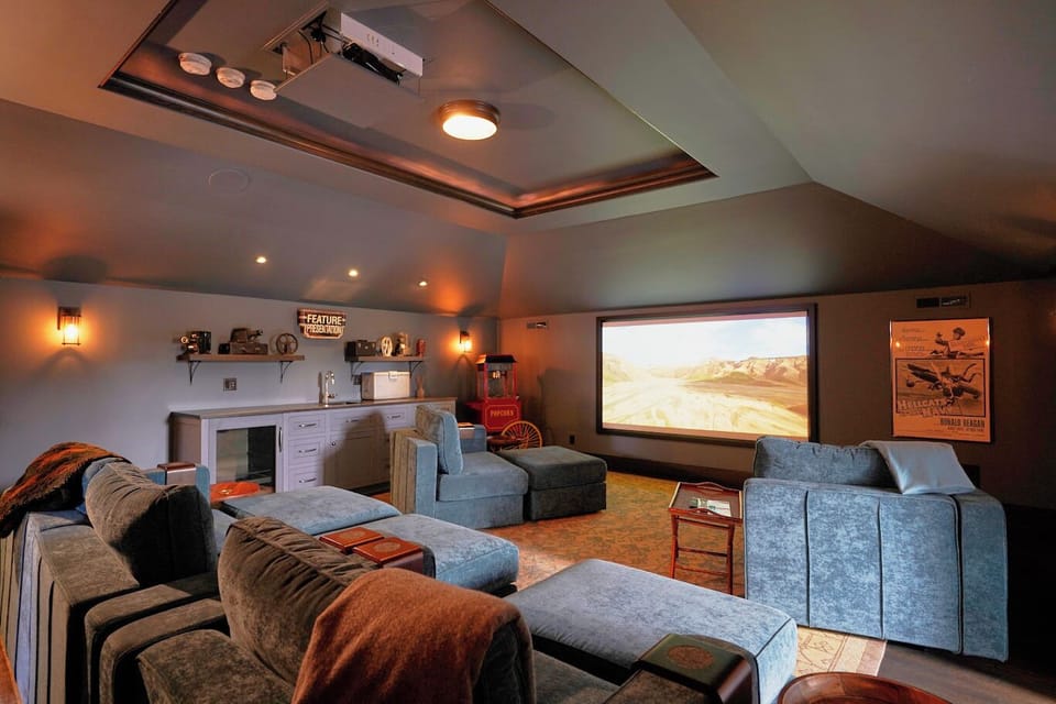 Movie theater on the top floor with dropdown projector and apple tv. 