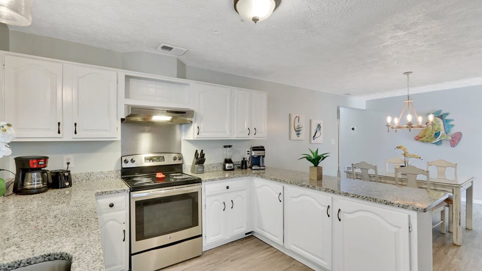 Basic kitchen supplies are stored in the cabinets. 