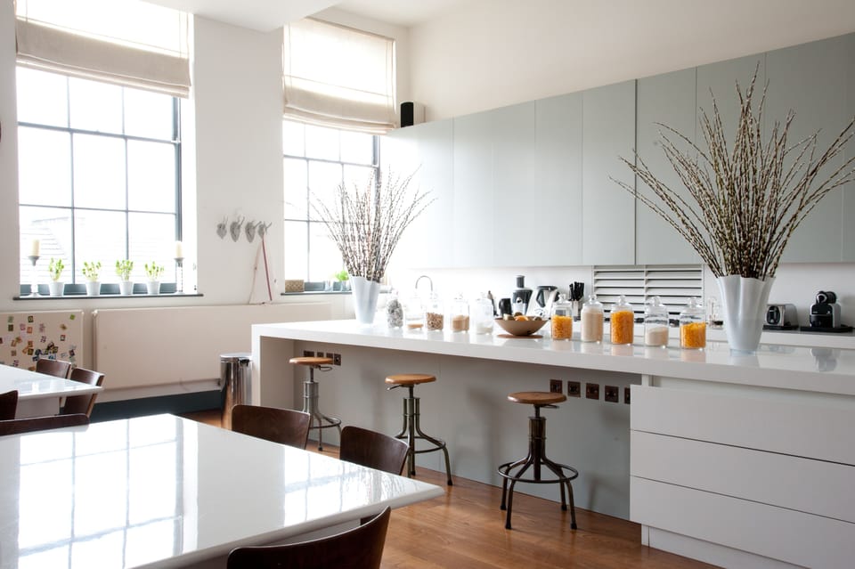 State of the art kitchen with an abundance of light and a piano