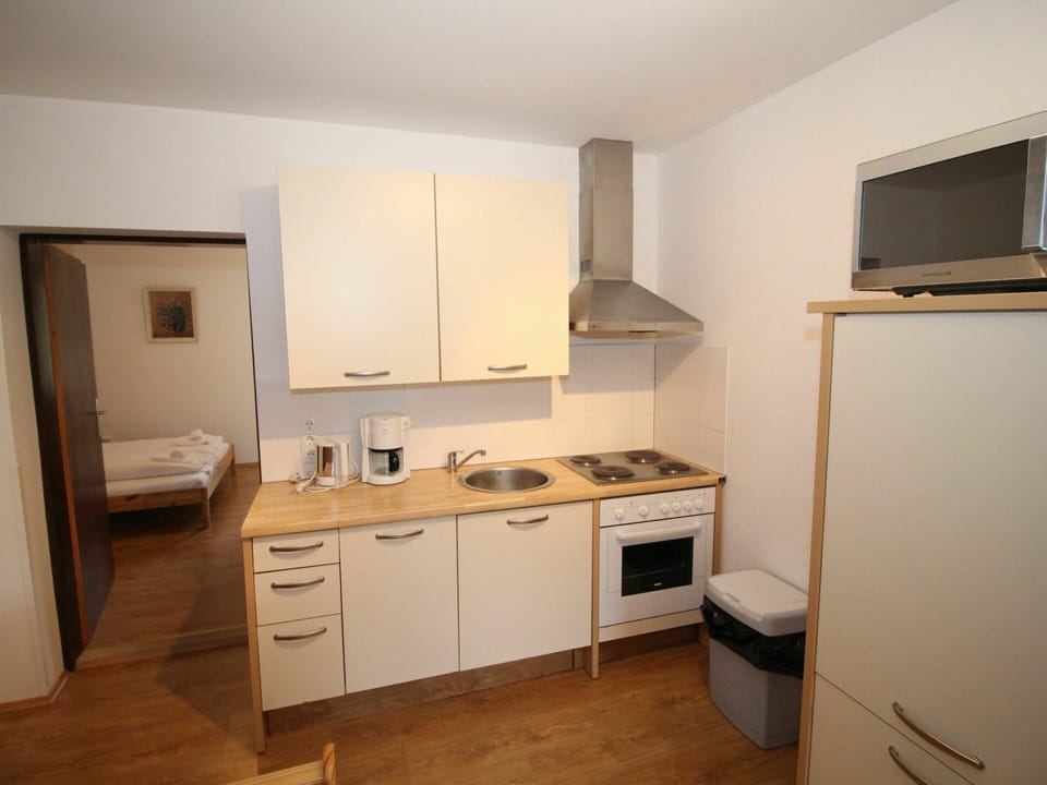 Cabinetry, Property, Countertop, Building, Wood, Drawer, Kitchen Appliance, Kitchen Stove, Home Appliance, Sink