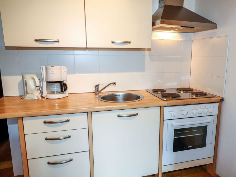 Countertop, Cabinetry, Kitchen, Room, Furniture, Property, Major Appliance, Kitchen Stove, Home Appliance, Gas Stove