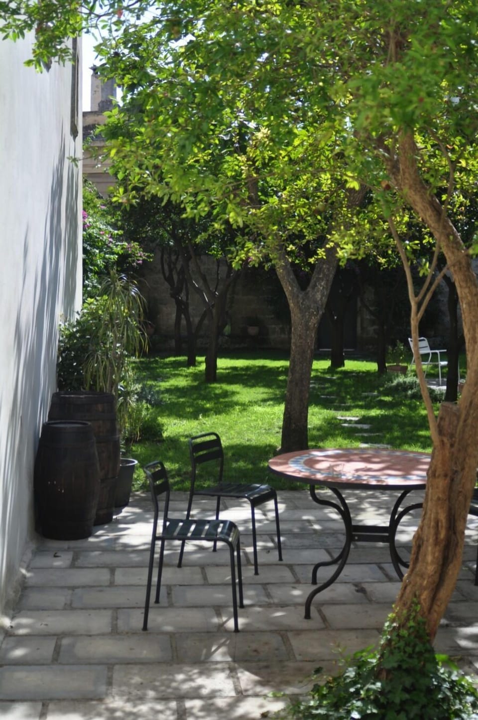 Kitchen opens to a private patio and garden.