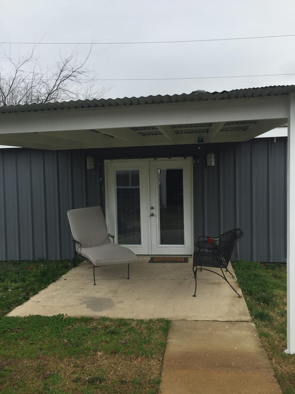 Covered patio for relaxing. Charcoal grill