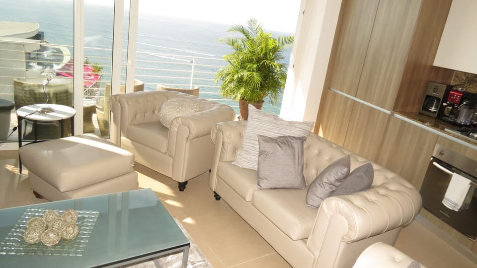 Living room area with beach and ocean view