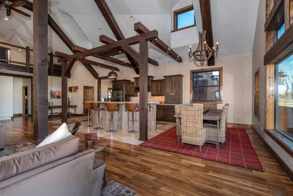 Open floor plan with dining room and bar seating