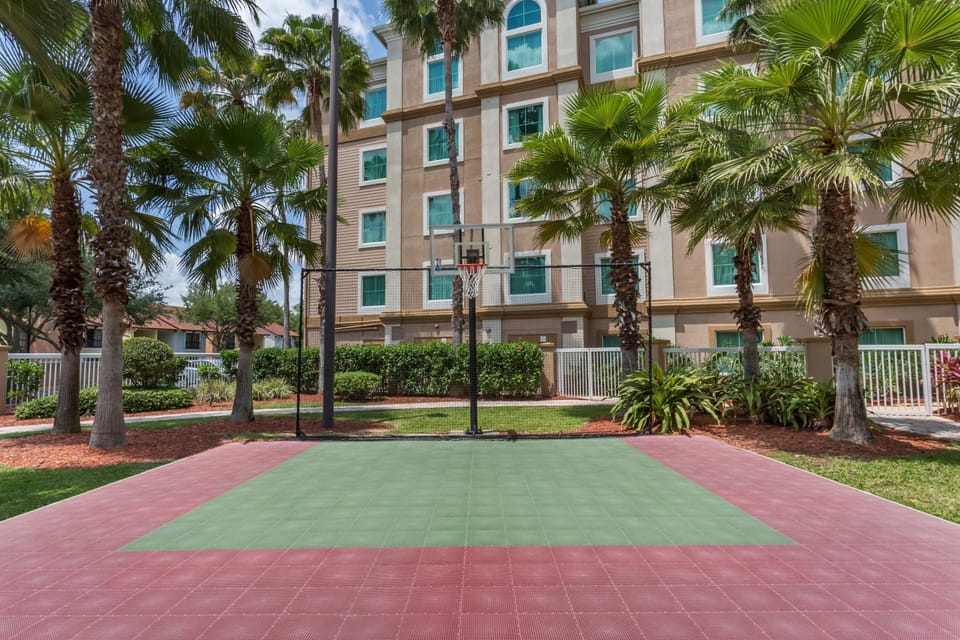Share laughs on the basketball court outside.