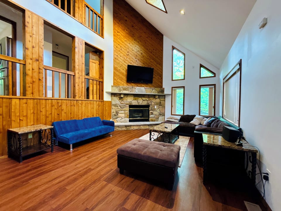 Living Room with Cathedral Ceilings and 65" LED TV