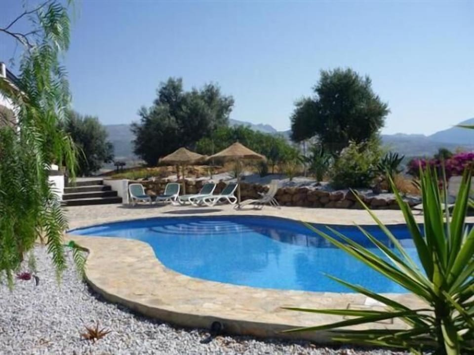 Luscious pool side sunbathing with mountain and lake views.