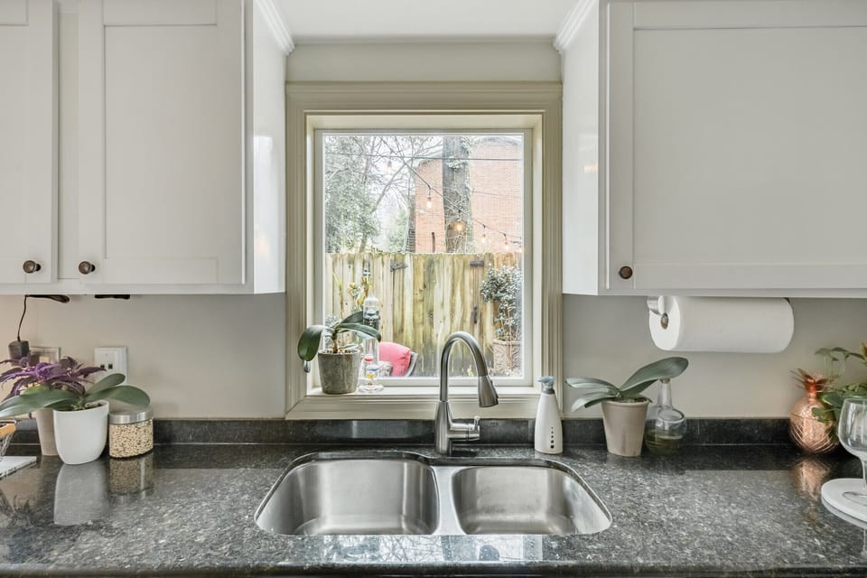 Granite countertops and modern cabinetry.