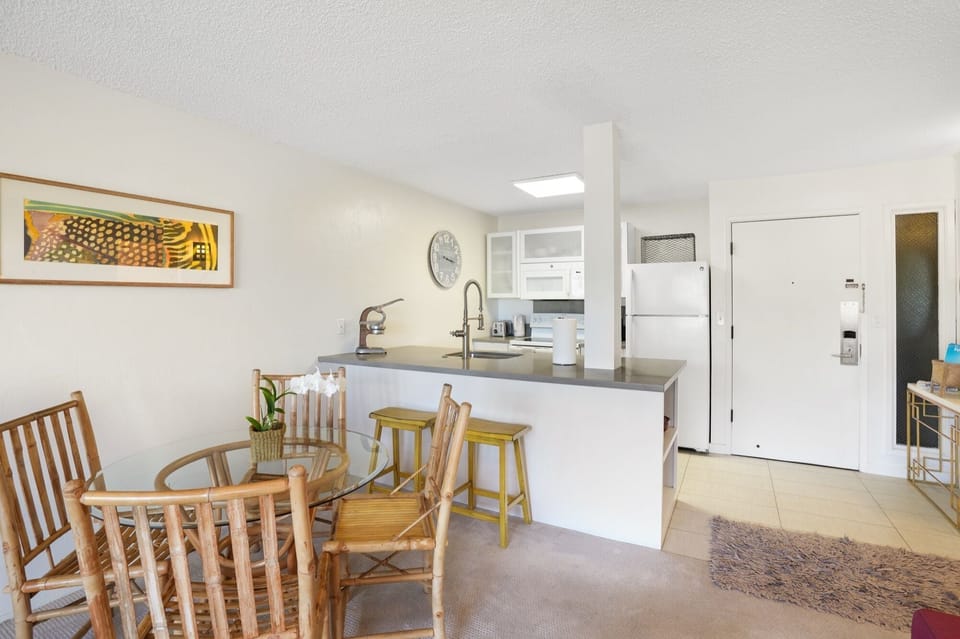 Eat at the dining room table .. or grab a snack sitting on the yellow bar stools