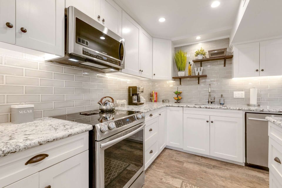 Renovated and Well appointed kitchen opens to dining and living areas