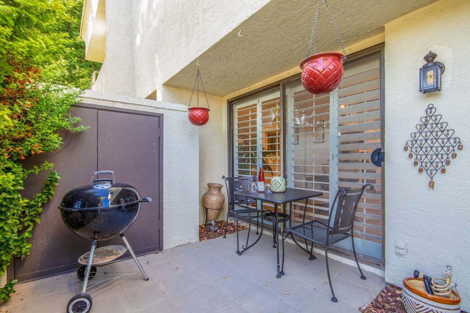 On the patio there's a table and chairs for 2 and a charcoal grill to cook up your favorites!