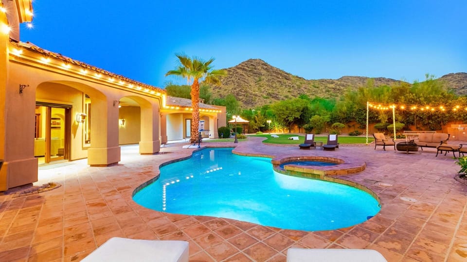 Amazing view to Mummy Mountain from the back yard, pool, & spa w/ games
