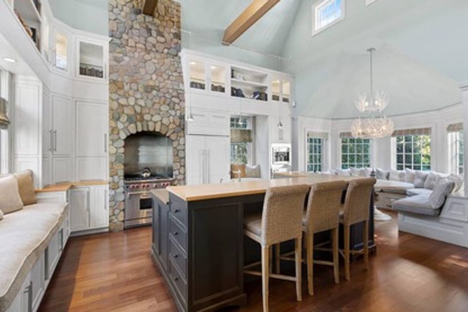 Light-filled gourmet kitchen with subzero fridge, Wolfe stove, wet bar, three dishwashers, Miele and drip coffee makers