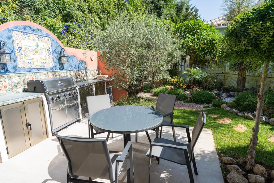 BBQ dining, fridge & hand sink. View here to 'Rockery' in the 'Secret Garden'.